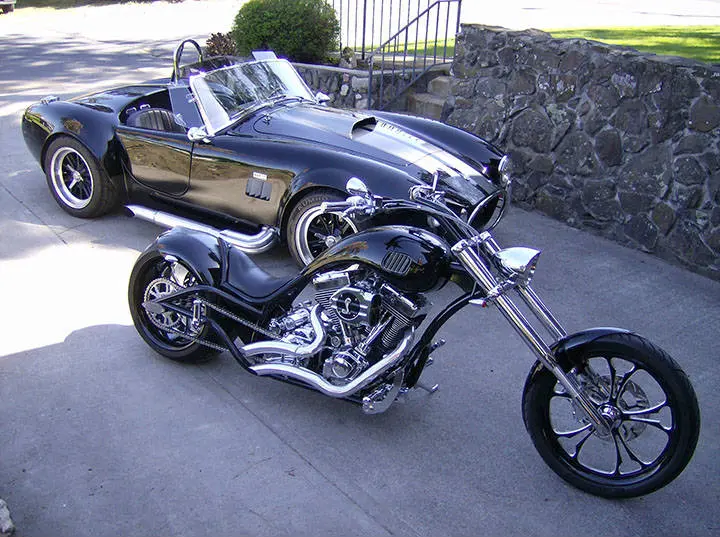 A parked bike and car